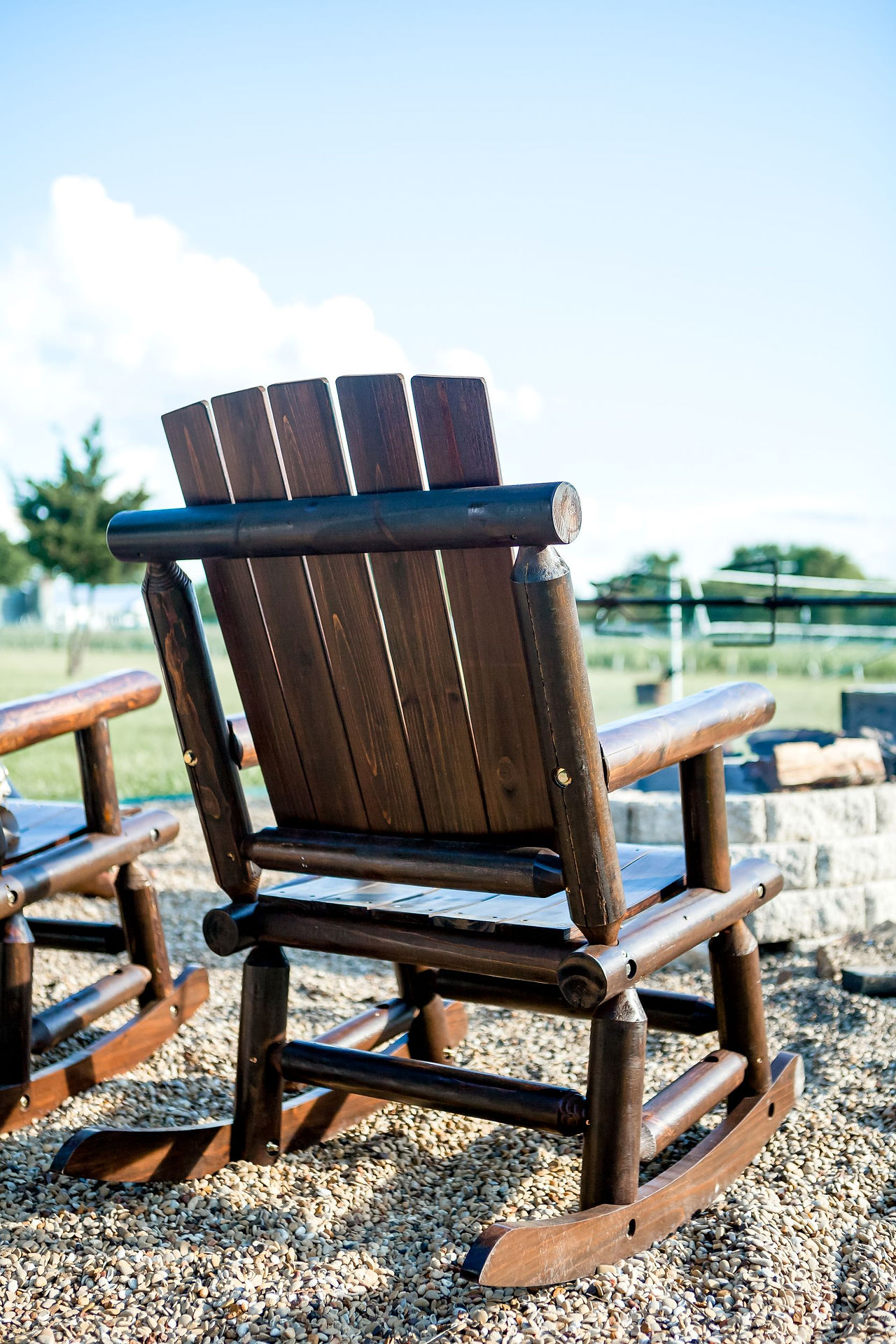 Rocking chairs around the campfire at Mars Hill Farm, south of Dallas, TX. Image by Photography of Sarah Mae