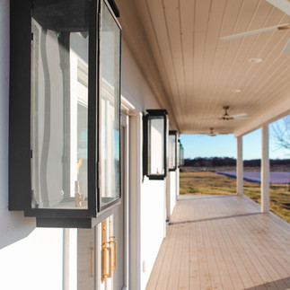 An up-close look at the black lanterns that line the front of the Selah Event Venue in Pilot Point, TX. Image captured by Photography of Sarah Mae.