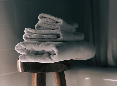 white towels on brown wooden stool_edite