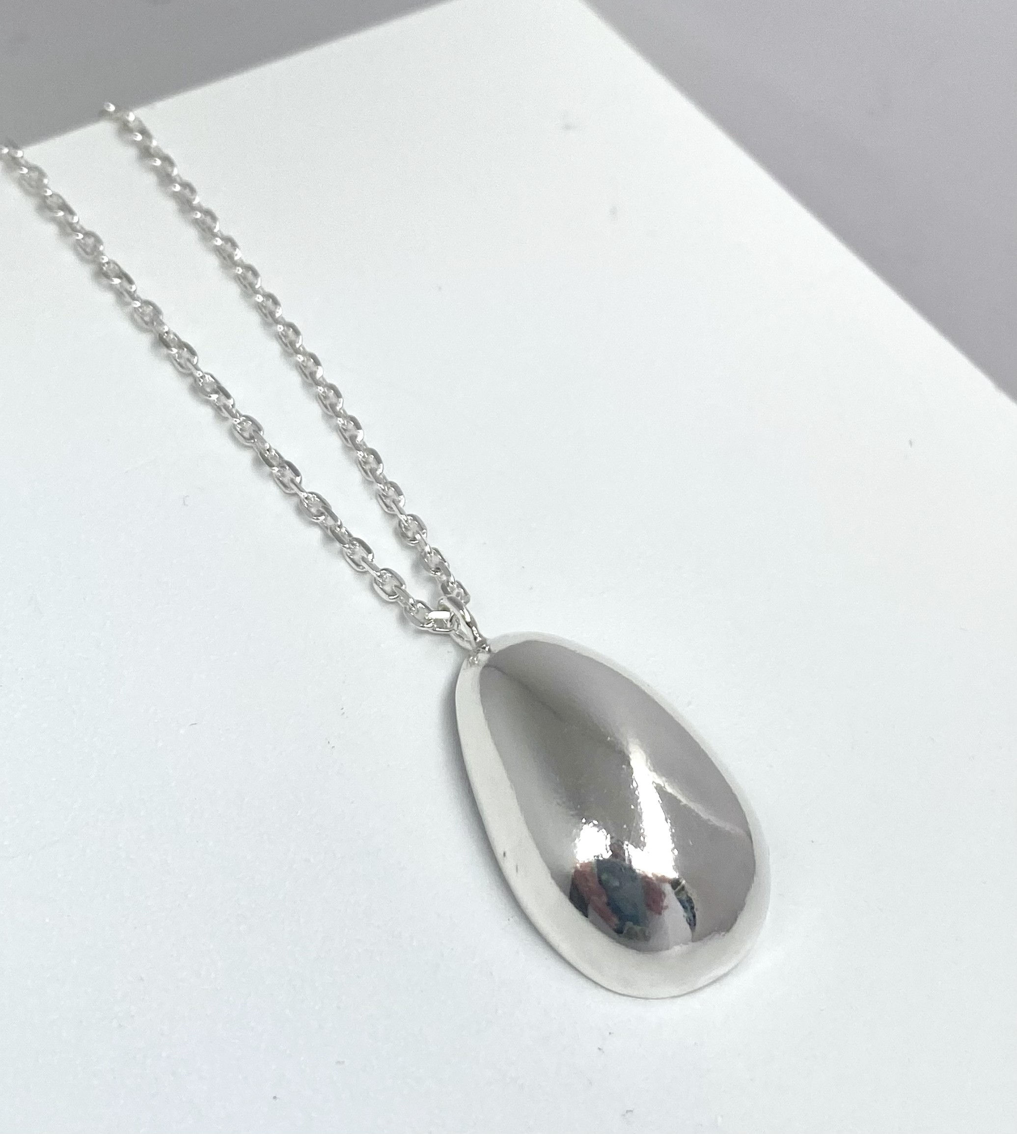 Handmade shell necklace smooth sleek domed exterior with the hand textured interior
