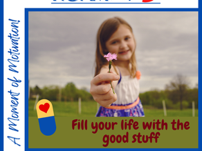 A smiling girl standing in a field holding out a pink flower. Text: "Fill your life with the good stuff." 
