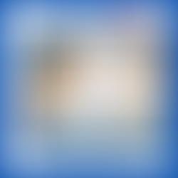 Coffee cup and pen on wood table. Napkin reads "Just another magic Monday."