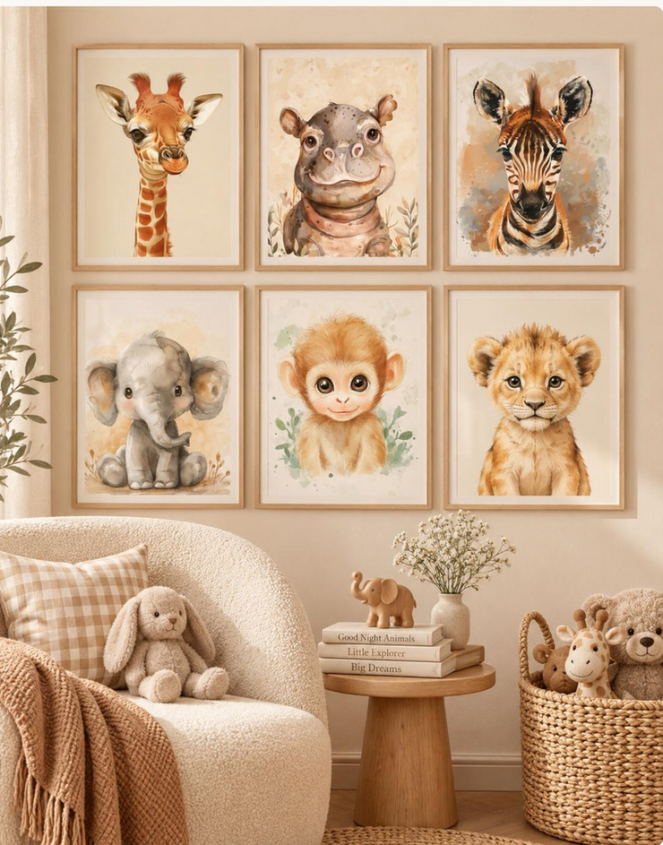 Watercolor baby safari animal prints framed on neutral wall.