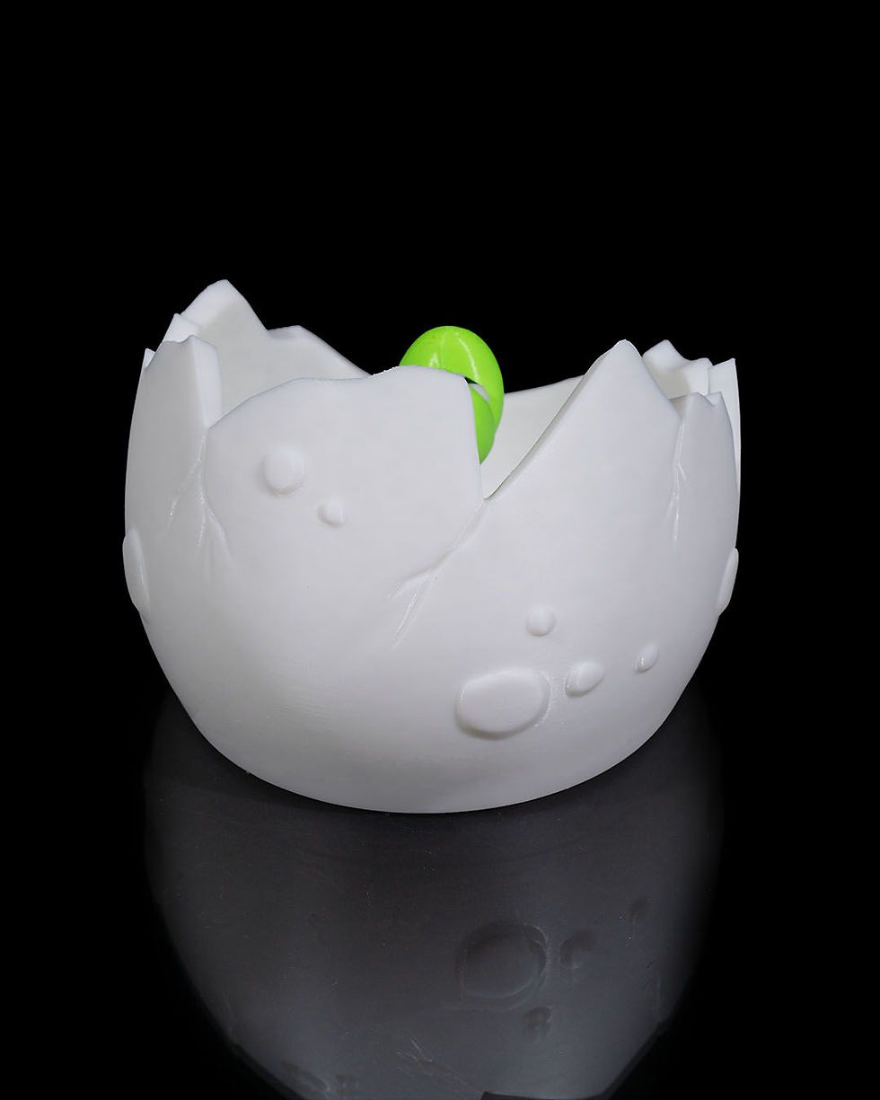 Thumbnail: Baby dinosaur hatching from egg