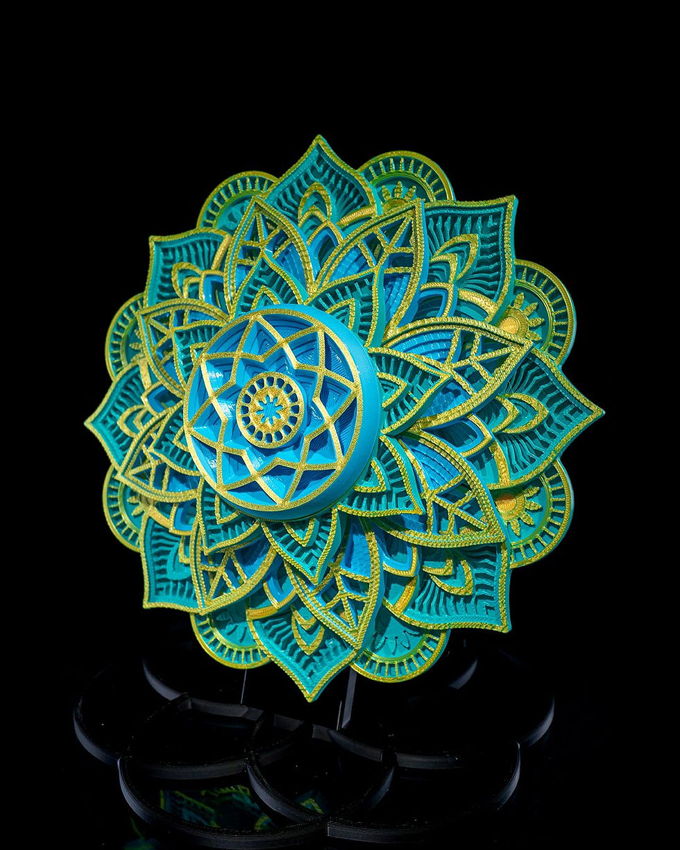 Thumbnail: Intricate teal and gold mandala design
