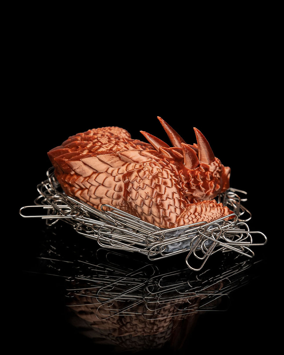 Thumbnail: Copper dragon figurine in paperclip nest