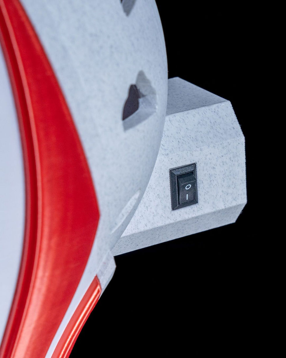 Thumbnail: Red and white device with power switch