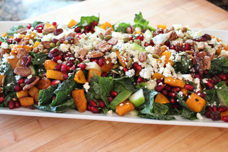 Kale and Candied Butternut Squash Salad with Blue Cheese Crumbles and Pomegranate