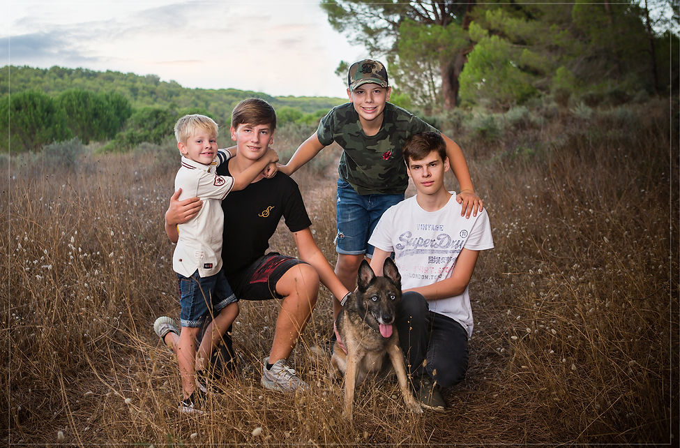 Family portrait along with dog in field