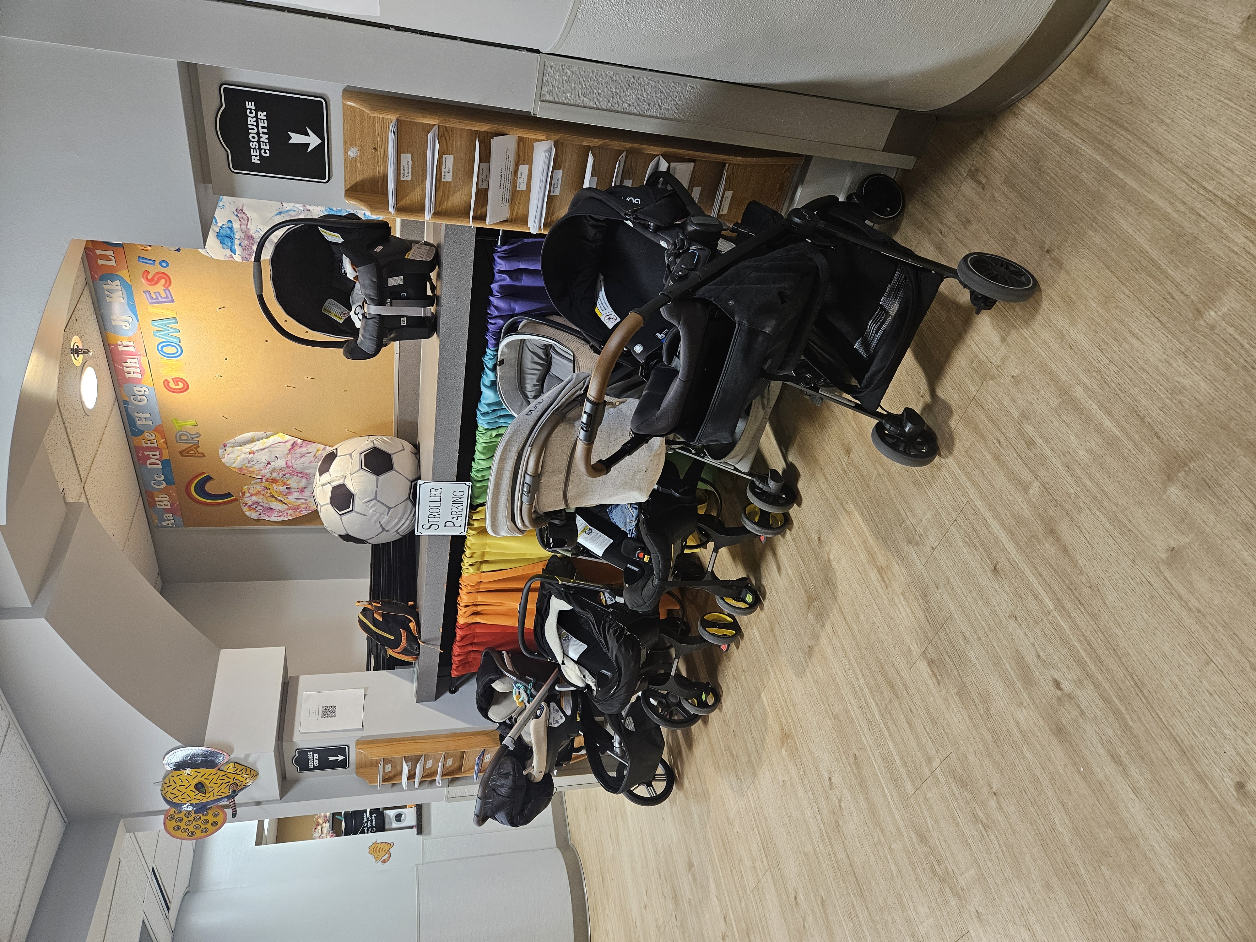 Daycare stroller parking area at childcare center with organized stroller storage and parent drop-off space in St. Louis.