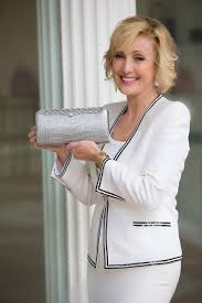 Lana Marks shows off one of her fancy handbags.