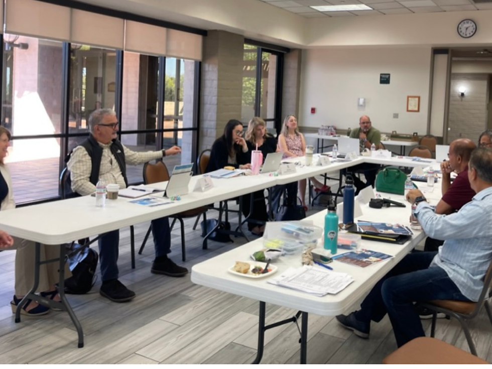 Foundation board members seated around tables during a planning and discussion meeting.