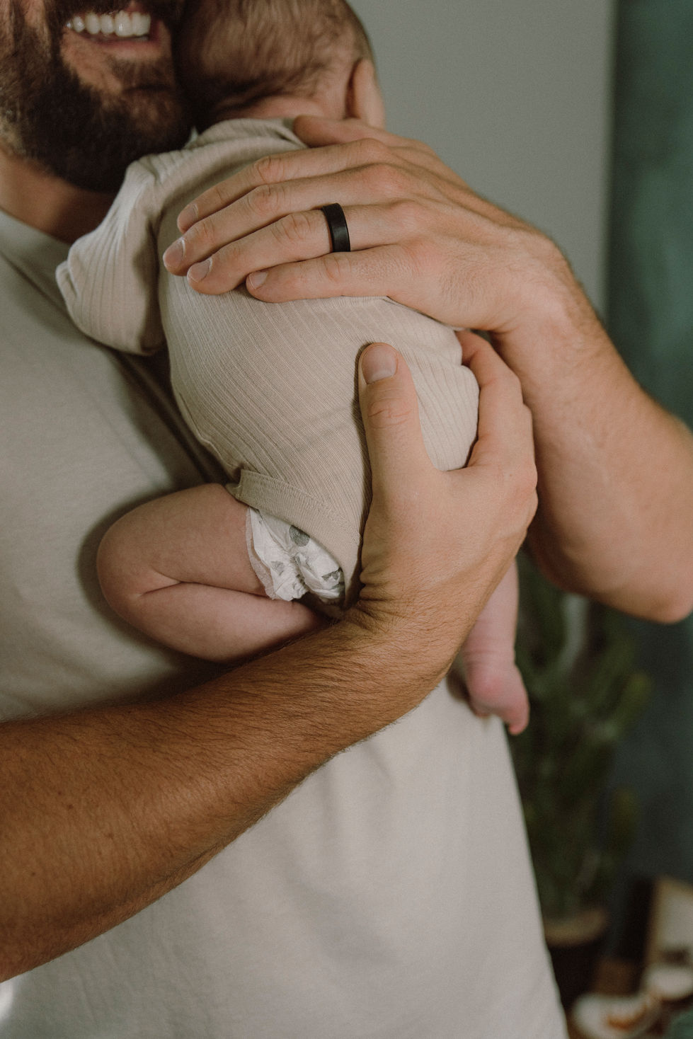 dad holding baby