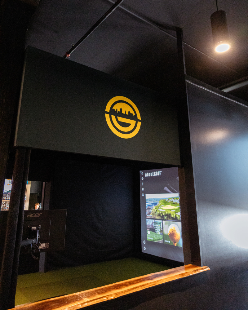 Indoor golf simulator bay at Urban Golf, The Fairfield Fort Wayne