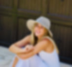 Smiling woman in a sun hat for Vision Bar gallery