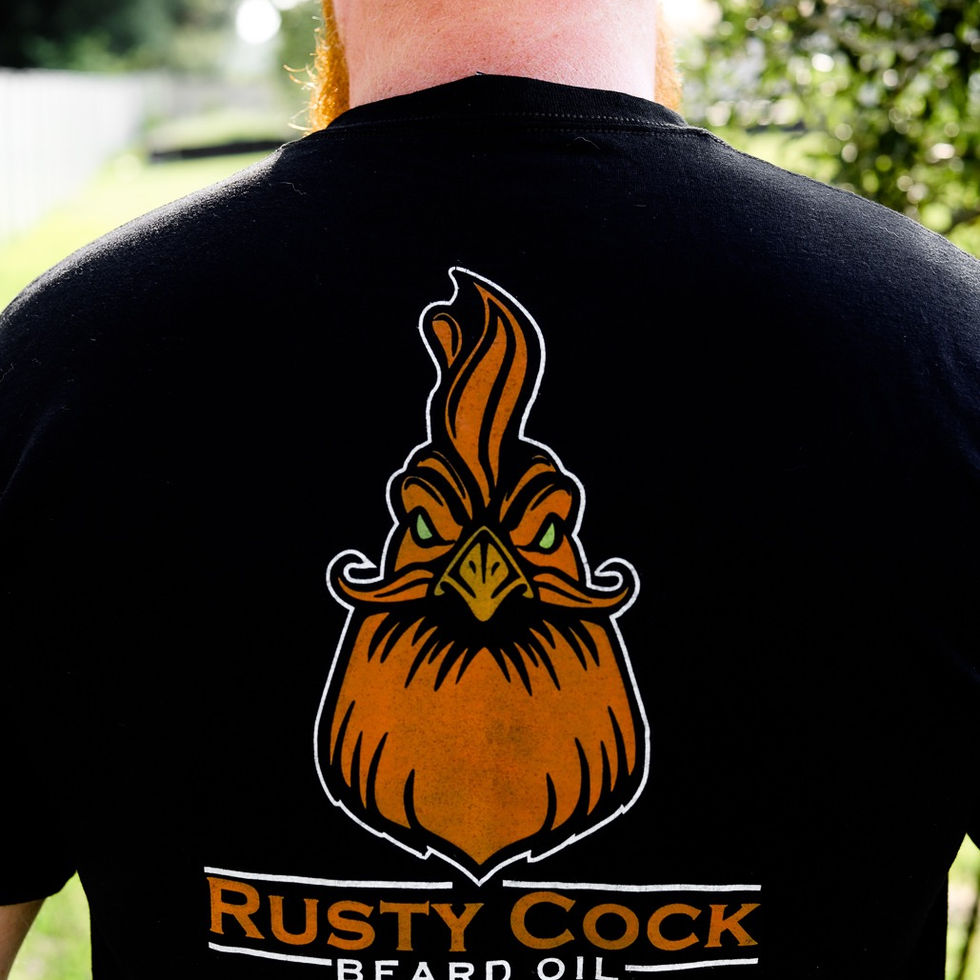 Red Bearded man wearing Black Rusty Cock Beard Oil T-Shirt Back View