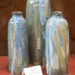 Three large ceramic vases in green and blue.