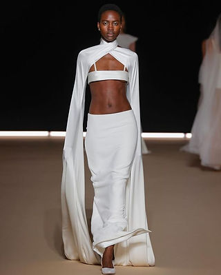 Cropped top and dropped waist skirt with wrap around cape
