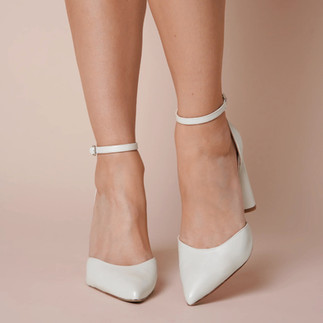 Charlotte Mills London classic Ivory leather point toe bridal shoes with ankle strap and slim block heel.