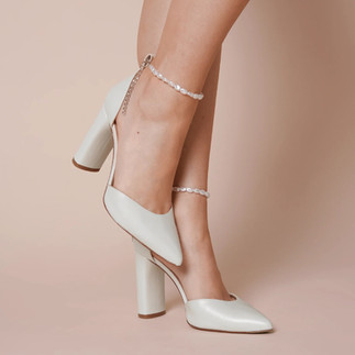 Charlotte Mills London classic Ivory leather point toe bridal shoes with ankle strap and slim block heel.