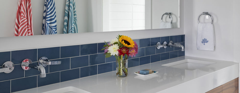 Bathroom vanity with blue subway tile
