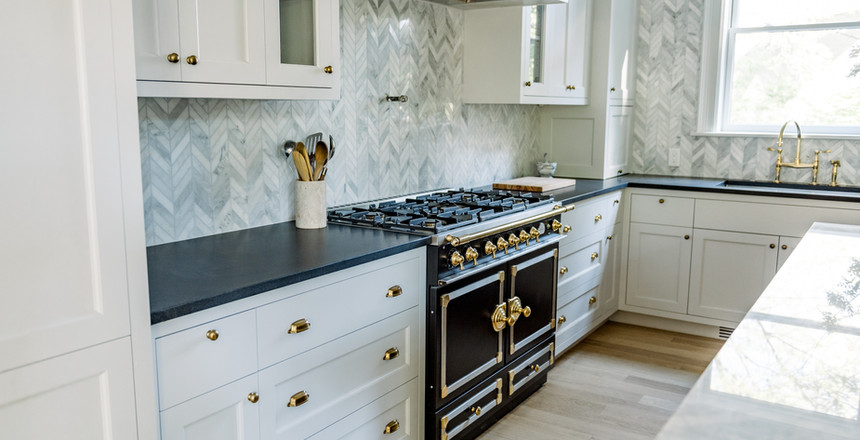 Black and white kitchen with Carrara marble counters
