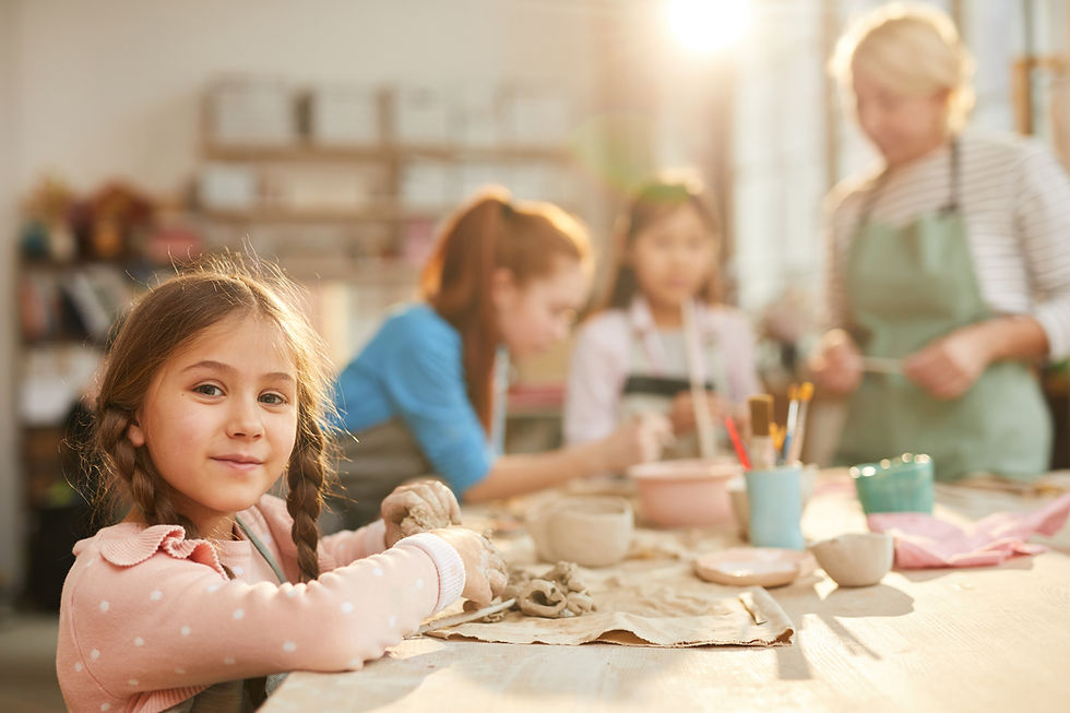 girls-and-woman-working-with-clay-art-together-2026-03-20-00-25-23-utc.jpg