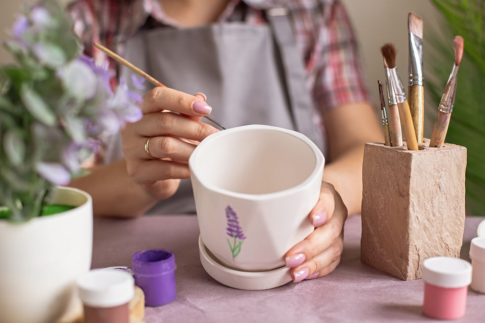 woman-painting-a-flower-pot-at-home-2026-03-17-21-28-46-utc.jpg