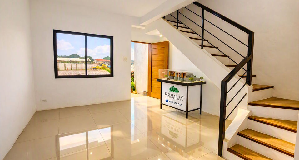 Modern townhouse interior with staircase and Serene Townhomes model.