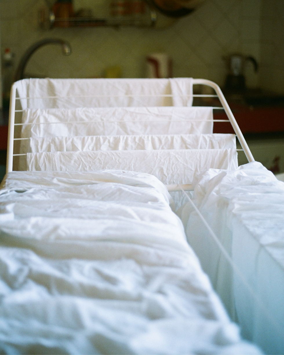 White laundry drying on clothing rack