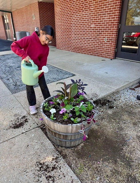 Fourth graders at George Nettels Elementary planted and maintain flower pots at the school thanks to a Foundation grant.