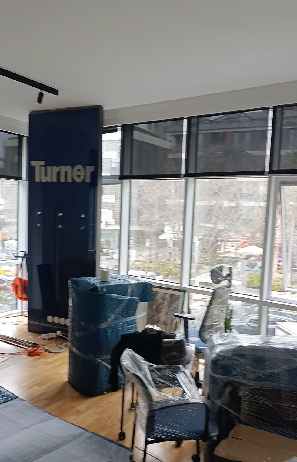 Close-up view of packed moving boxes stacked in a hallway