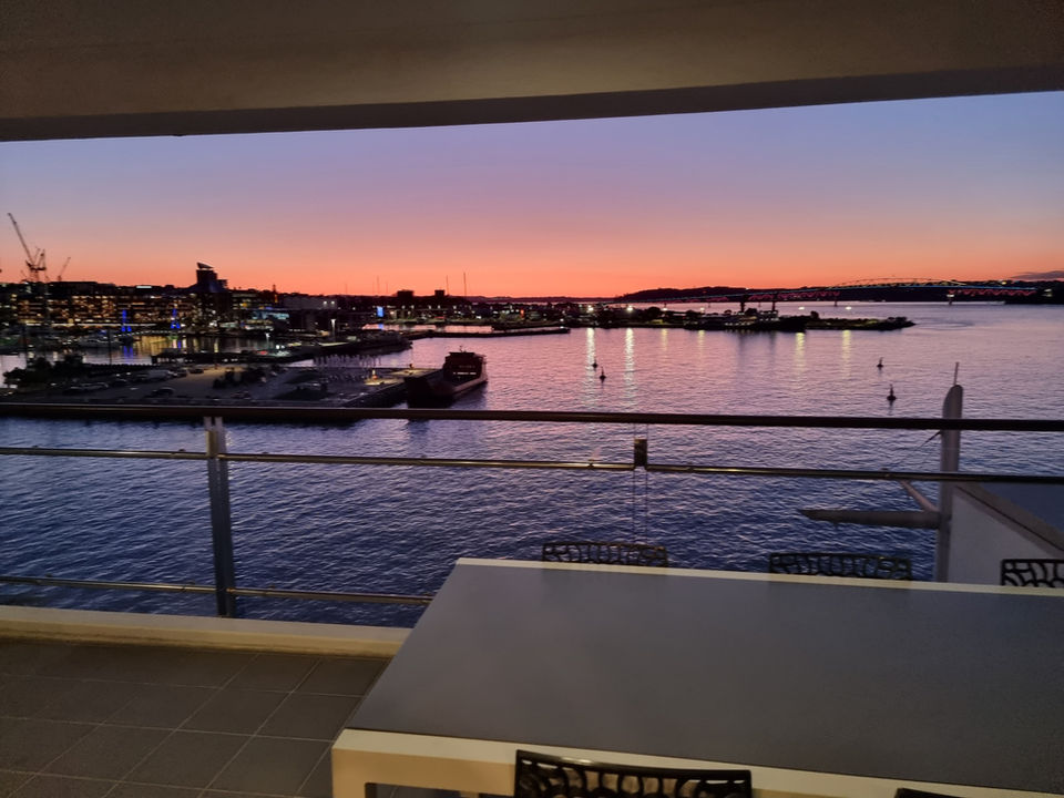Open-plan living space at Shed 40, Viaduct Harbour, styled by Kerri for Urban Butler’s Airbnb guests.