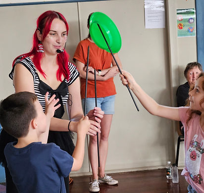 Circus-themed activation space with roving performers and games at a Melbourne event
