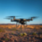 Black Drone flying with a tether connected to it that goes all the way to the ground.jpg