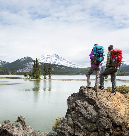 Backpackers standing on a scenic lookout