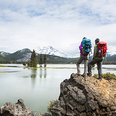 Backpackers standing on a scenic lookout