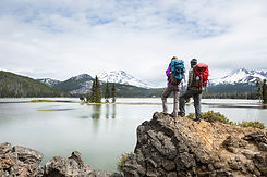 Backpackers standing on a scenic lookout