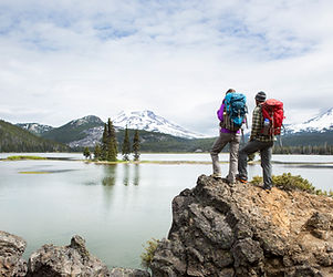 Backpackers standing on a scenic lookout