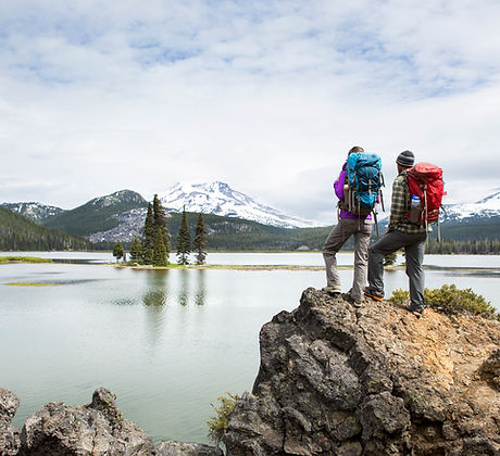Backpackers standing on a scenic lookout