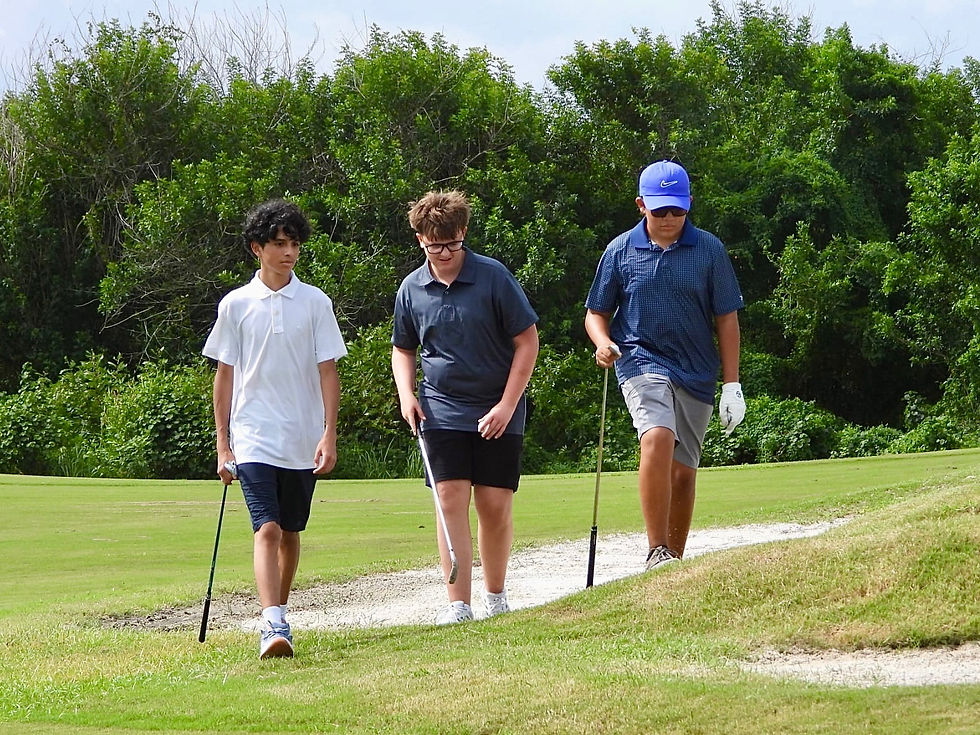 Junior golfers and a coach gather for instruction on the putting green at Royal St. Cloud Golf Links in Central Florida, representing Florida Junior Golf brand partnerships and youth golf experiences.