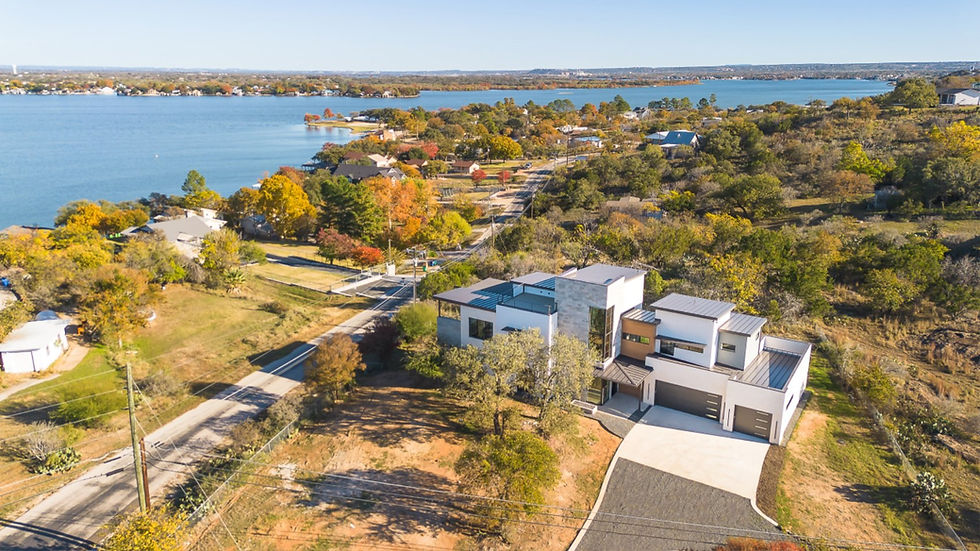 Aerial view of modern homes by a lake