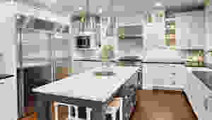 Uncluttered kitchen with quartz counter tops