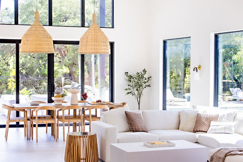 Spacious modern living, dining area with white sofa. Interior Design.