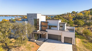 Modern house with flat roof overlooking a lake
