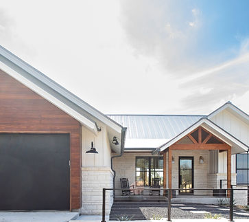 Modern house with wood accents and black garage door