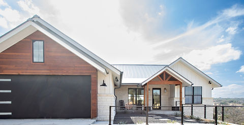 Modern home exterior with garage and wooden porch