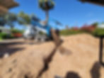 a dirt dump truck unloading free dirt into a site