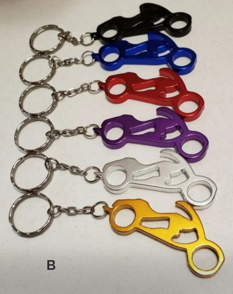 Metal motorcycle keyholder and bottle opener. Available in various colours.