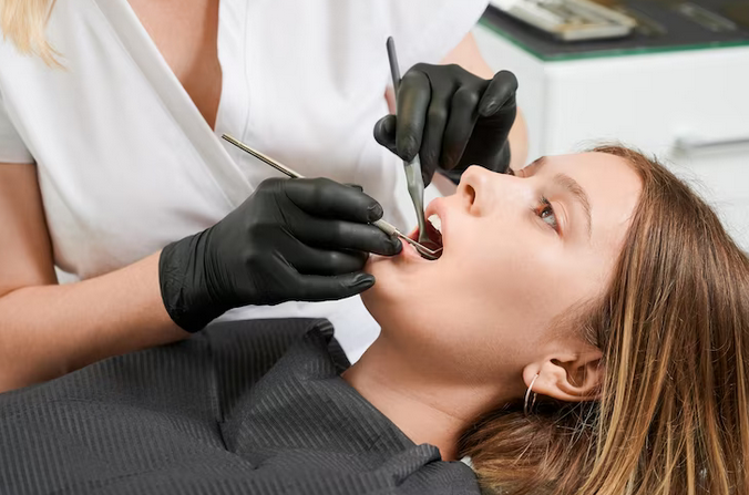 a woman getting her teeth checked